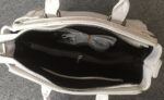 Vibrant Embossed Cartoon Leather Arm Bag