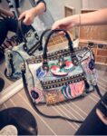 Edgy Studded Printed Denim Bag