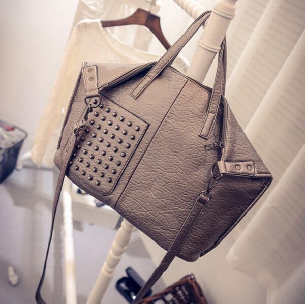 beige color studded rivet soft leather sleeve bag