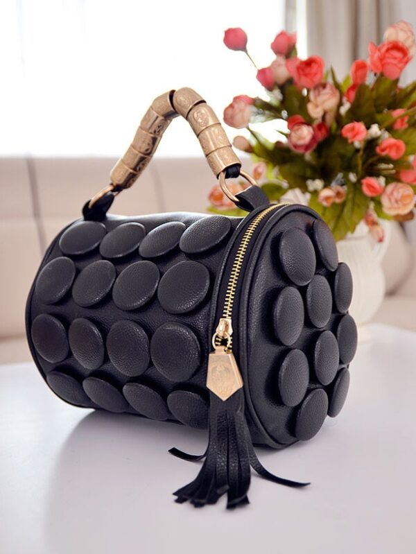 black buttoned cylinder design leather bag