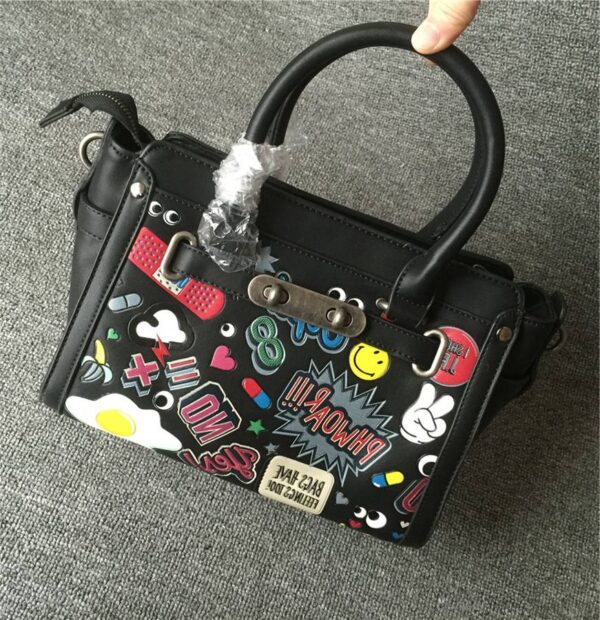 black colored cartoon women genuine leather sleeve bag