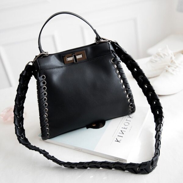 black leather wovens sleeve bag