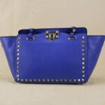 Rock-chic Studded Trapeze Genuine Leather Arm Bag