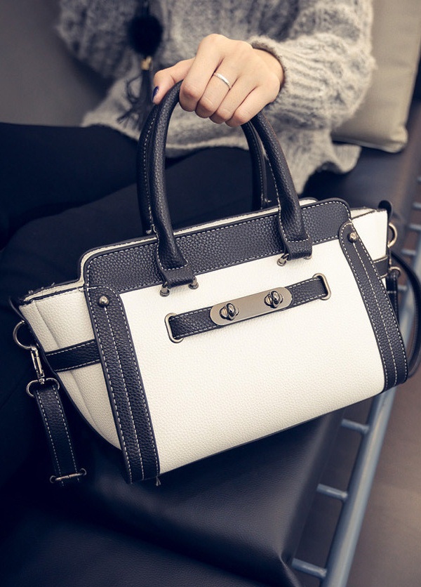 embossed leather black white sleeve bag