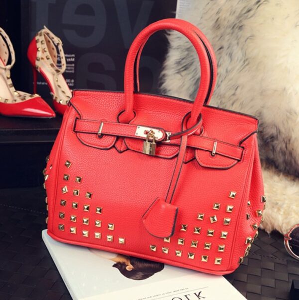 embossed leather red studded rivet bag
