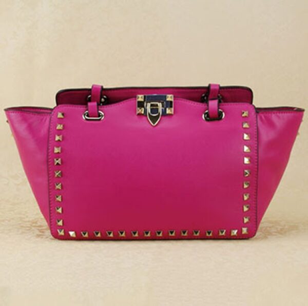 fuchsia studded rivet trapeze sleeve bag