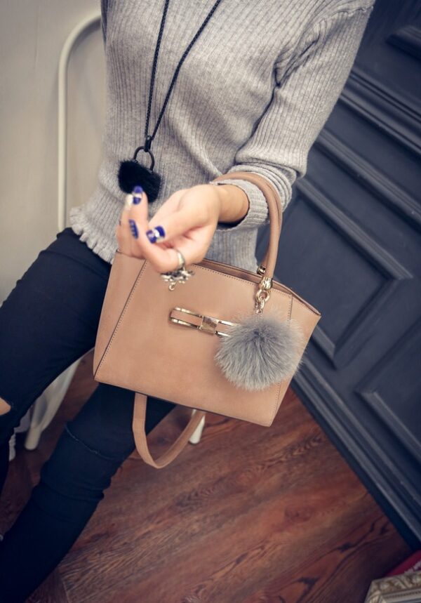 fur embellished tan leather bag