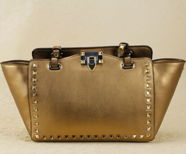 gold studded rivet trapeze sleeve bag