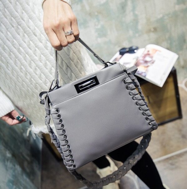 gray leather wovens sleeve bag