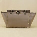 Rock-chic Studded Trapeze Genuine Leather Arm Bag