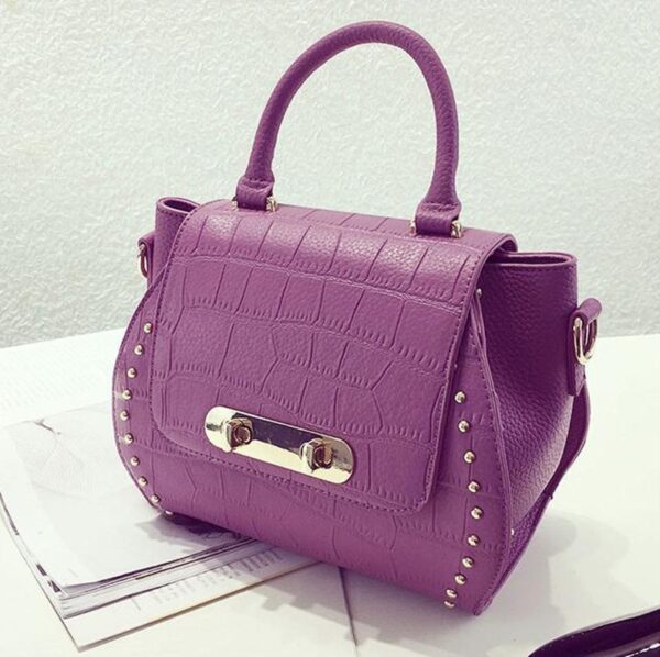 purple embossed leather sleeve bag