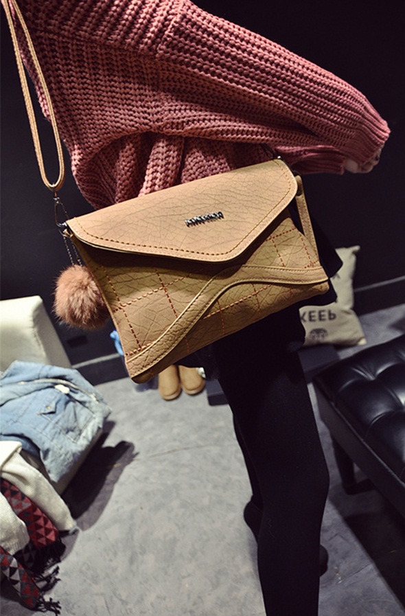 2026 Handbag Trends: Luxe Studded Leather Bags, Chain Straps, Fringe Designs & Plush Must-Haves Dominating World Fashion 125 tan color leather pom pom envelope bag