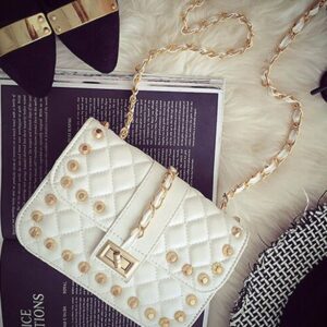 white studded rivet small hand sleeve bag