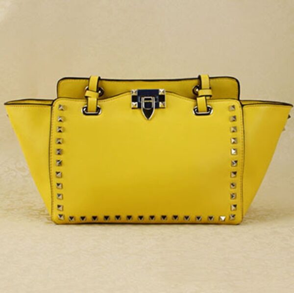 yellow studded rivet trapeze sleeve bag