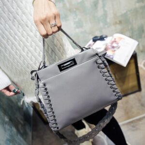 gray leather wovens sleeve bag